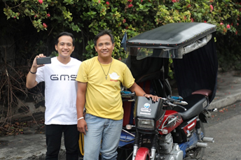 photo: GMS Philippines staff and tricycle driver