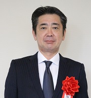 （写真）佐久本　学　氏
