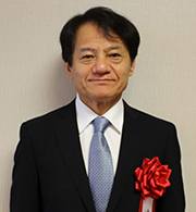（写真12）辻居 幸一氏（※「辻」は、一点しんにょう。）