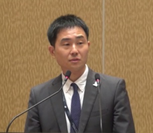 （写真）閉会挨拶の様子（JPO：岡本国際協力室長）