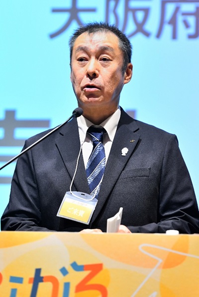 （写真）大阪府商工労働部　中小企業支援室　室長　元木 一典　氏（吉村知事の代読）